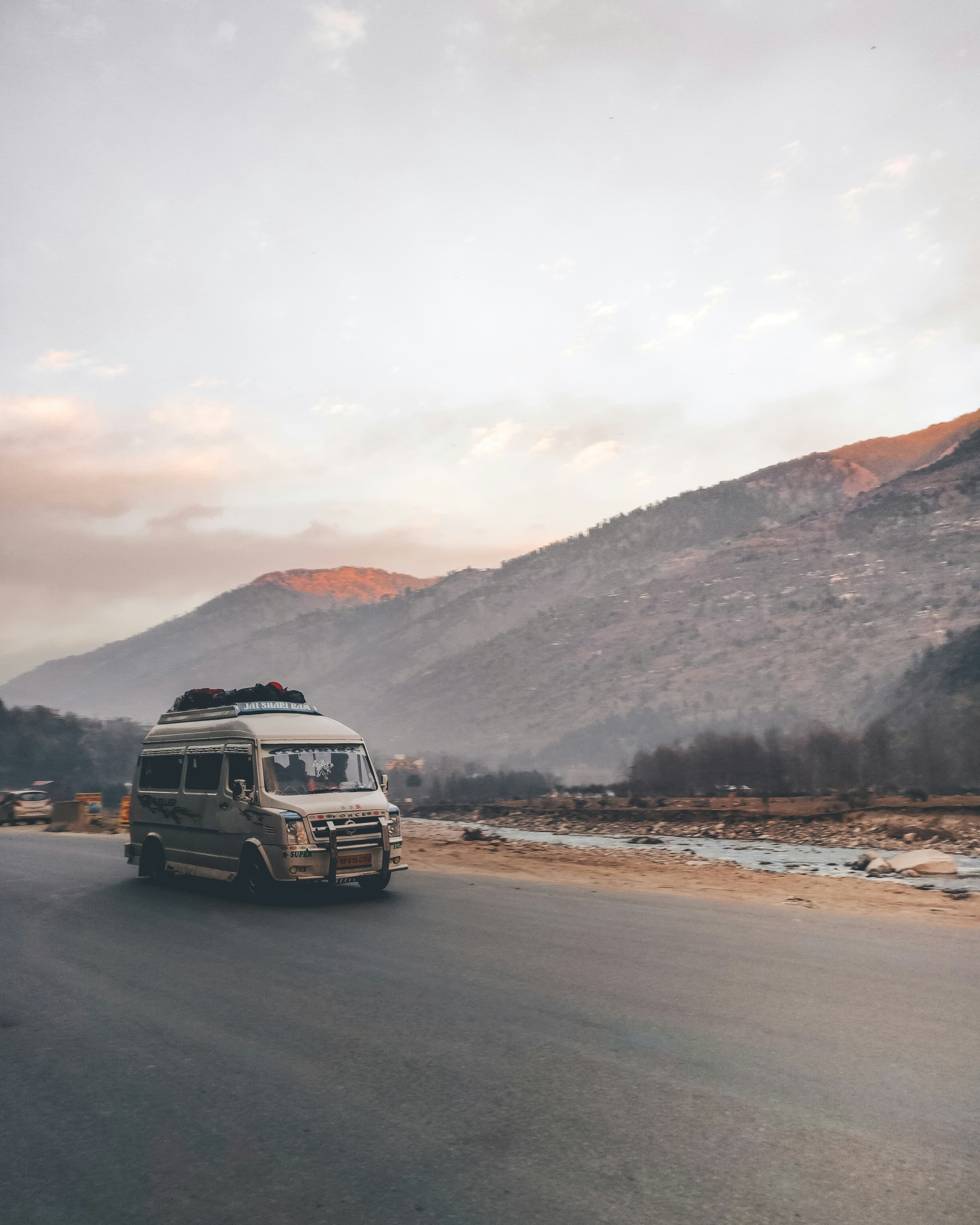 A private vehicle on a mountain road through the Himalayan foothills